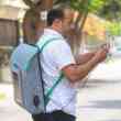 entrepreneurs create eco-friendly backpack made of recycled plastic and built-in solar panel